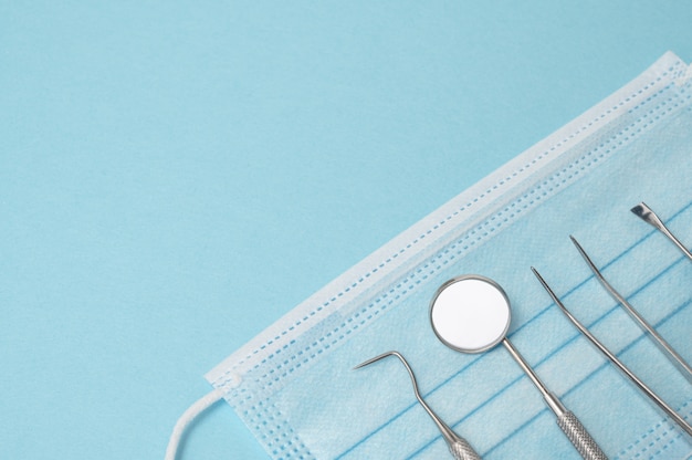 Dental tools on blue background. Medical technology concept. Dental hygiene. Cure concept. Dentist tools. Dental equipment.