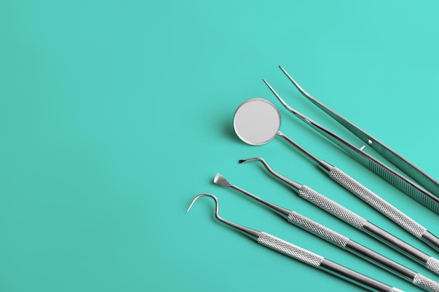 Dental tools on blue background top view