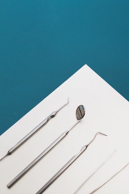 Dental tools on a blue background