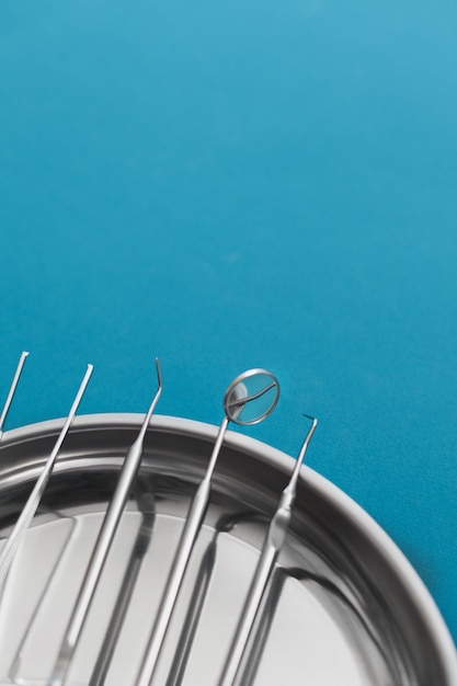 Photo dental tools on blue background