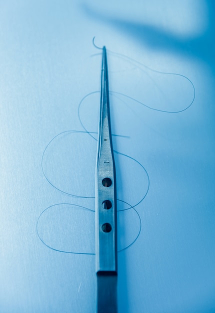 Dental tools on blue scenery.