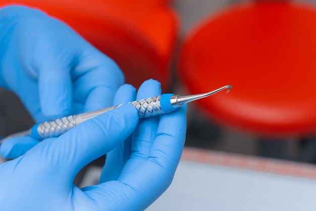 Dental tools in the hands of a doctor