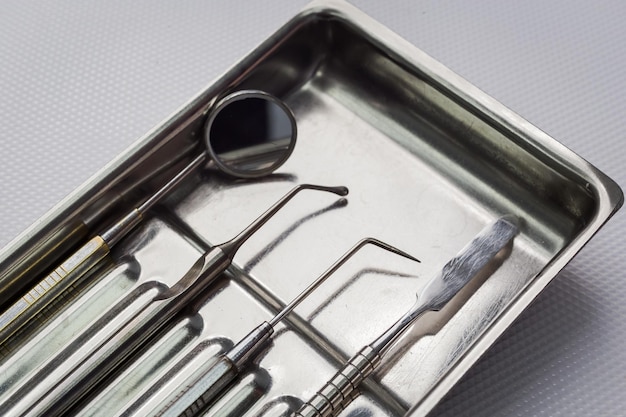 Dental tools on white background top view Stomatology