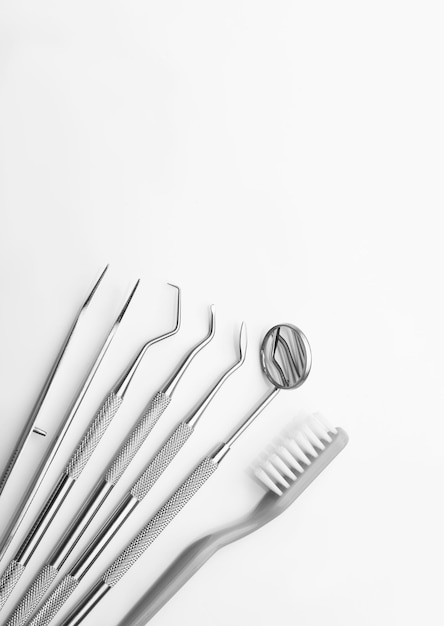 Dental tools on white background top view