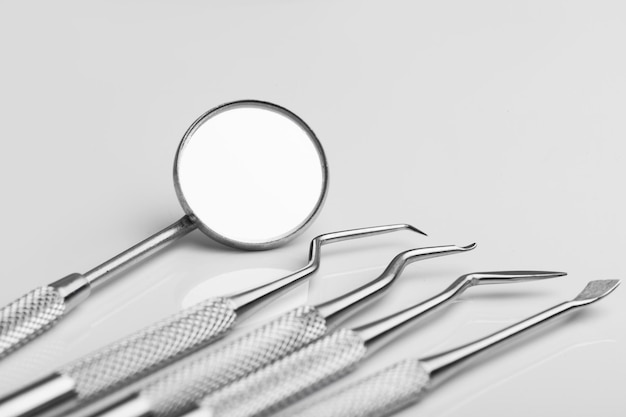 Dental tools on white background top view