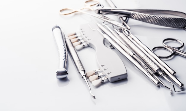 Dental tools on white table