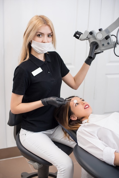 Dentist checking the patient in the clinic