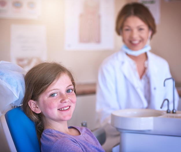 dentist child and portrait with doctor for teeth cleaning or cavity treatment for oral hygiene or dental health paediatric clinic and happy girl kid with woman and smile for medical consultation