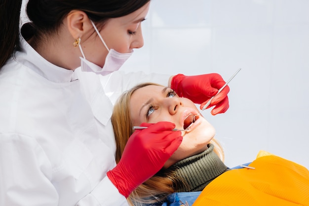 The dentist conducts an examination and consultation of the patient. Dentistry