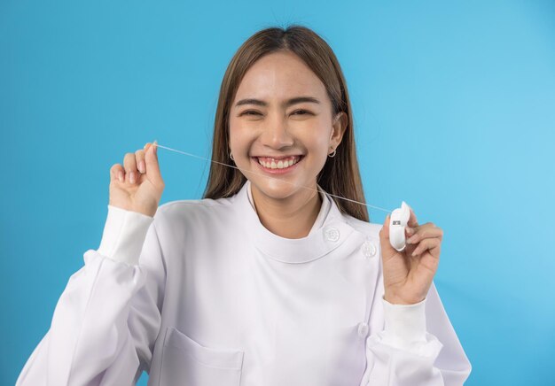 Dentist demonstrating a jaw model and a dental instrument. The notion of oral hygiene