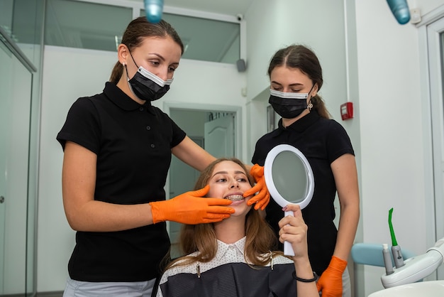 Dentist examines the patient with braces. healthcare