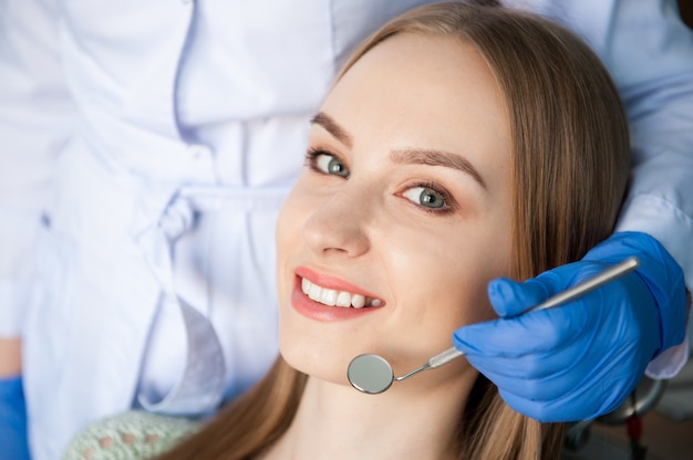 Dentist examining a patient's teeth in the dental clinic.