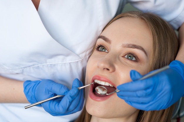 Dentist examining a patient's teeth in the dental clinic.