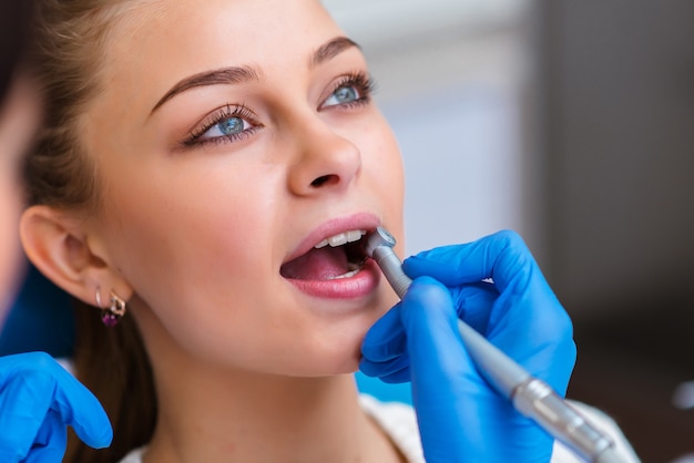 Dentist examining a patient's teeth in the dentist office