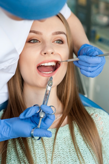 Dentist examining a patient's teeth. Professional medicine.