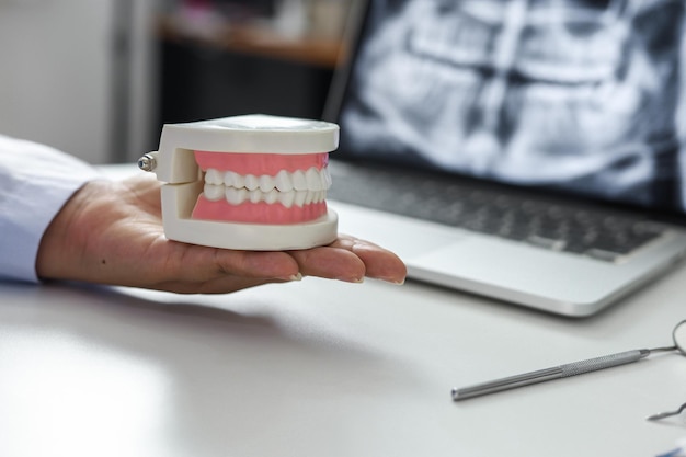 Dentist examining a patient teeth medical treatment at the dental clinic