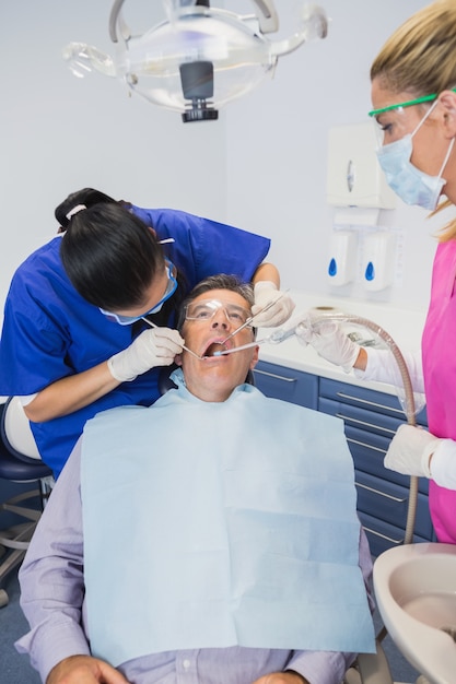 Dentist examining a patient 