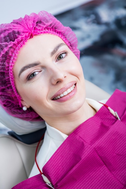 Dentist examining teeth of a young woman patient in a dental clinic Dentistry concept