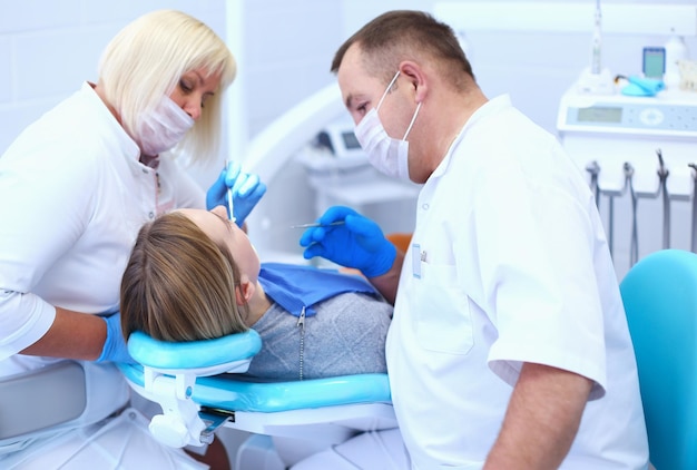 Dentist and his assistant carrying out a thorough examination