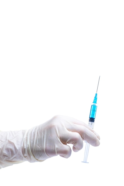 Dentist holding the syringe over the white background