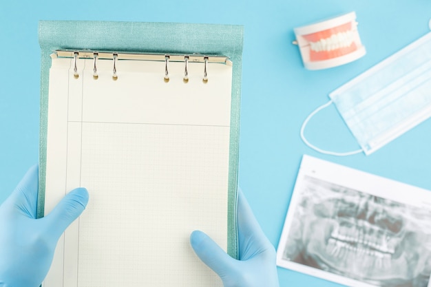 Dentist holds a snapshot of the jaw