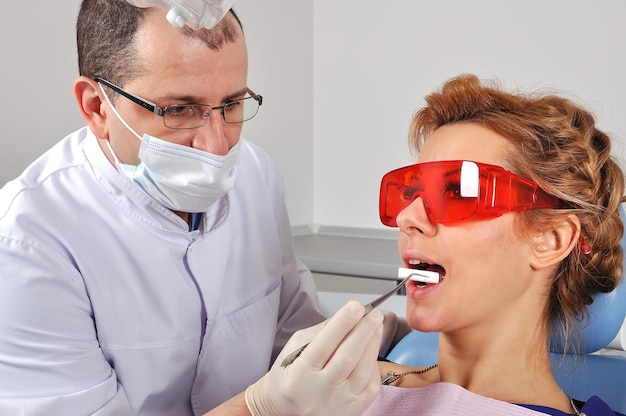 Dentist inserts swab