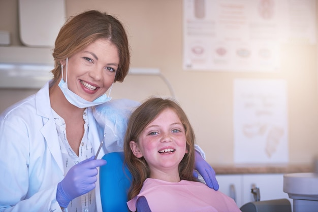 dentist kid or portrait for teeth cleaning or oral care for cavity treatment for tooth hygiene or dental health pediatric clinic or happy girl child with woman or smile for medical consultation