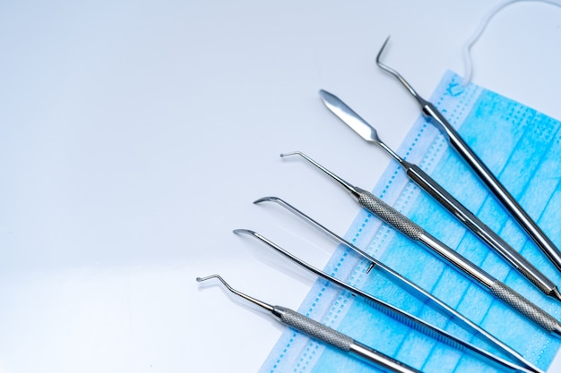 Dentist medical instruments for examining patient. Set of instruments.