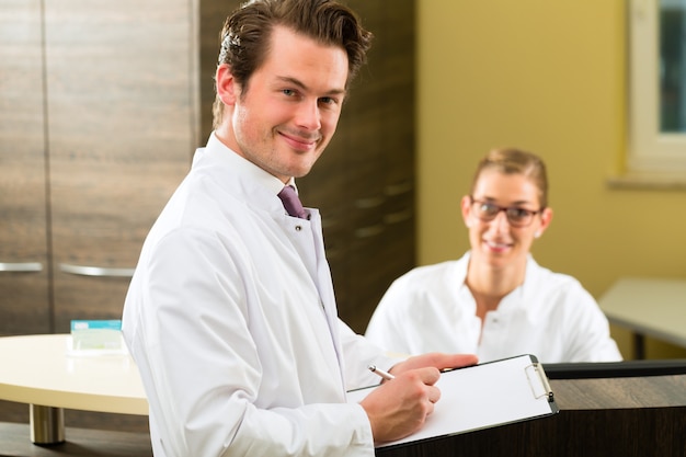 Dentist and nurse with clipboardclinic