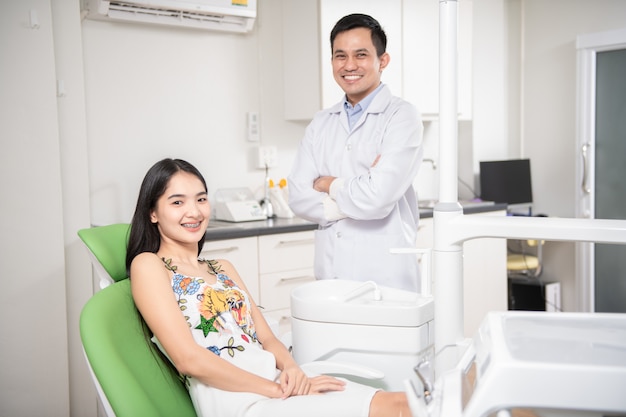 Dentist and patient in dentist office