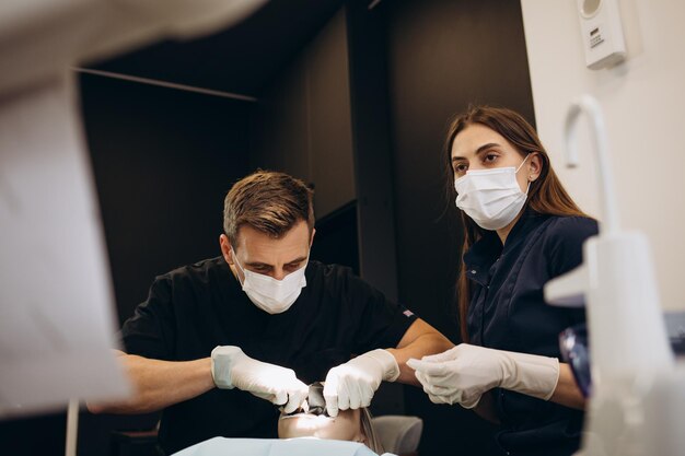 Dentist's appointment the girl puts and removes braces from her teeth