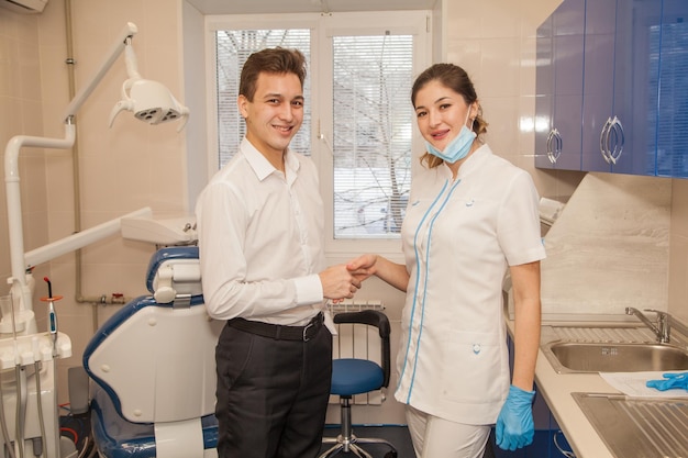 Dentist sees patients in his office