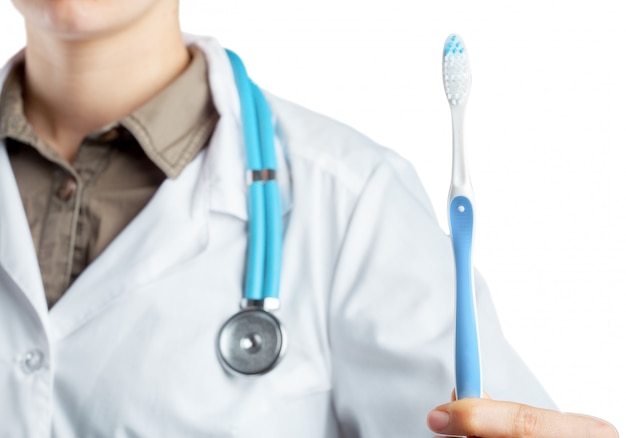 Dentist showing toothbrush