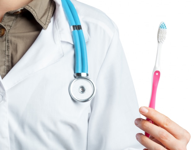 Dentist showing toothbrush