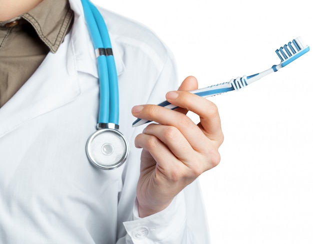 Dentist showing toothbrush