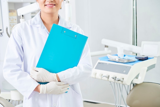 Dentist standing in dental clinic