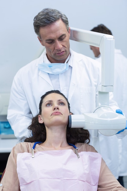 Dentist taking x-ray of patients teeth