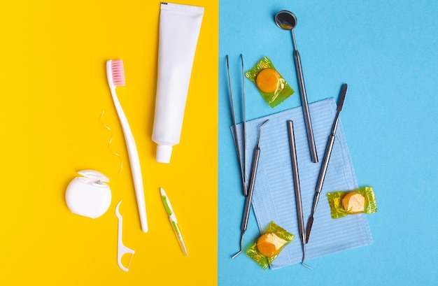 Dentist tools and dental hygiene products on yellow and blue background