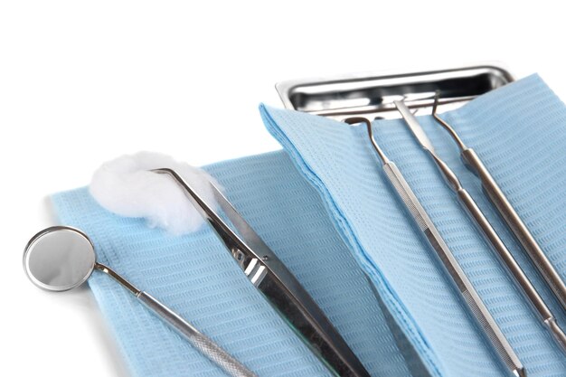 Photo dentist tools isolated on white