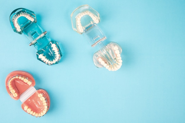 Dentist tools and orthodontic on the  blue background