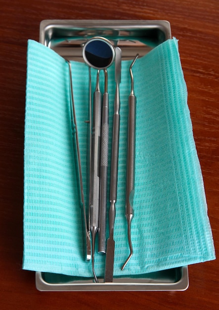 Dentist tools on wooden table