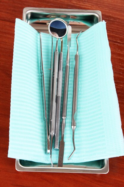 Dentist tools on wooden table