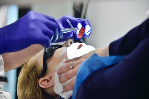 Dentist Treating Woman Patient