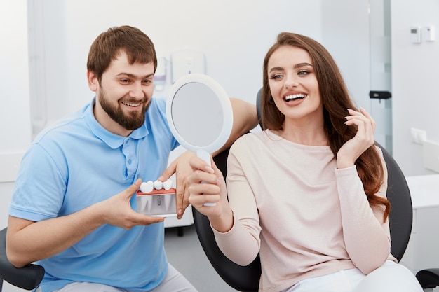 Dentist with satisfied patient