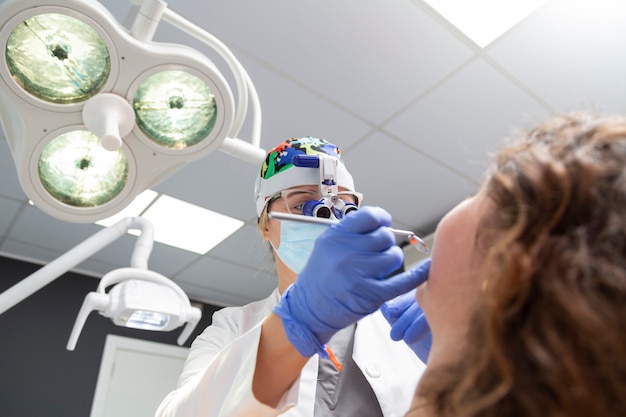 Dentist working on a patient in dental clinic