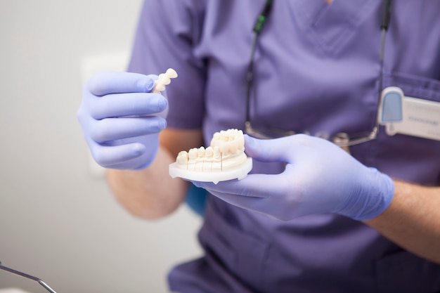 Dentist working with patient at his clinic