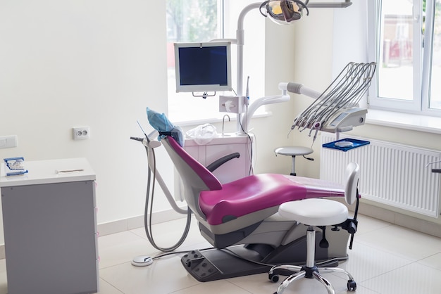 Dentistry inside, violet chair for patient and equipment