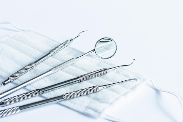 Photo dentistry tools for teeth dental care and treatment on white background