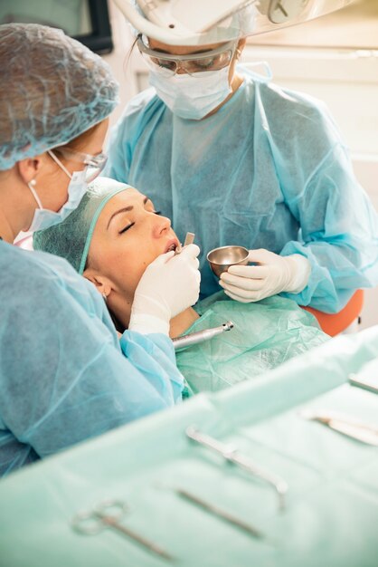 Dentists with a patient during a dental intervention. Dentist  Concept