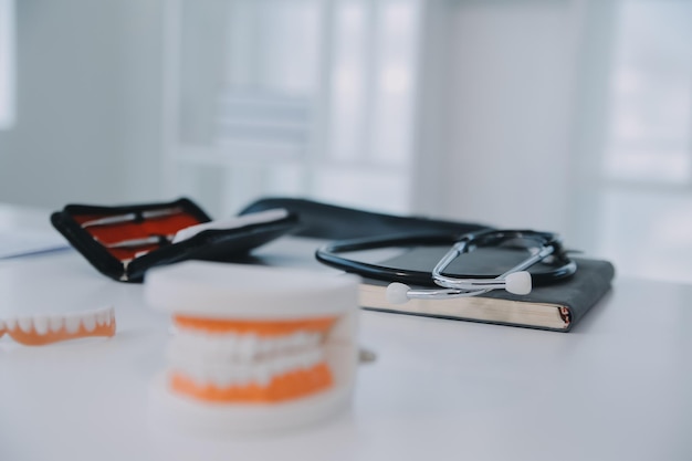 Denture and dental toolsdental mirror on white background